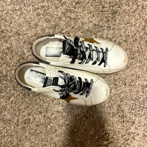 Golden Goose Sneakers, Size 37. Rarely worn. Gold star and dark grey sparkles.